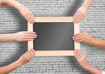 Hands holding frame