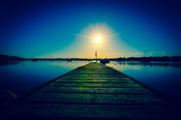 Marine pier and sun at sunset