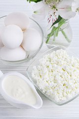 Tasty dairy products on wooden table
