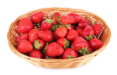 Ripe sweet strawberries in wicker basket, isolated on white