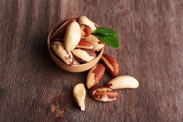 Tasty brasil nuts on wooden background