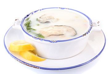 Tasty soup with oysters, isolated on white