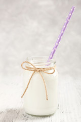 Bottle of milk on wooden table