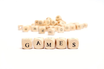 word with dice on white background- games