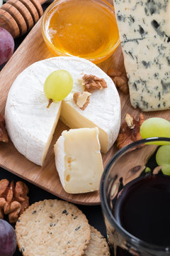 Assorted delicatessen appetizers - cheese, grapes, crackers