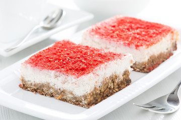 cream cakes with raspberries on the plate, selective focus