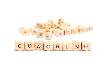 word with dice on white background- coaching - obrazy, fototapety, plakaty