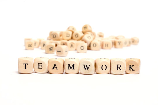 word with dice on white background- teamwork