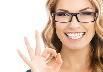 Businesswoman with okay gesture, isolated