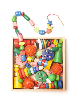 wooden box with many toys
