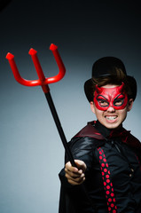 Funny devil against dark background