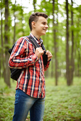 Teenager boy with school bag