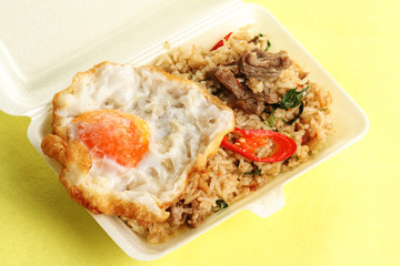 Fried rice with beef chili and basil topping fried egg