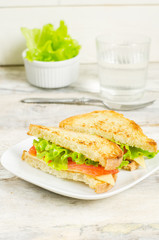 panini sandwiches with salmon, cheese and salad
