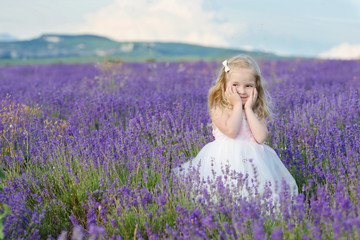 Fototapeta na wymiar sweet girl in lavender field