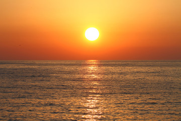 Golden sunset with reflection on the sea