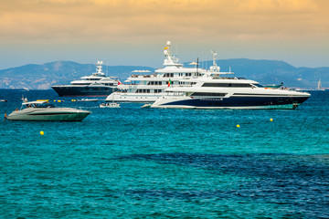 Fototapeta na wymiar Luxury yachts in turquoise beach of Formentera Illetes