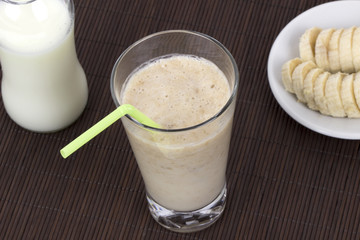 Banana milk smoothie  and drinking straw