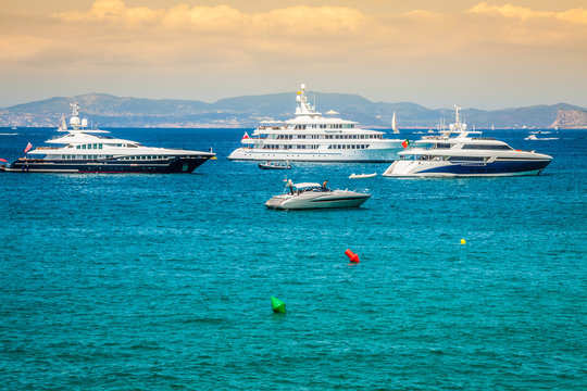 Luxury yachts in turquoise beach of Formentera Illetes