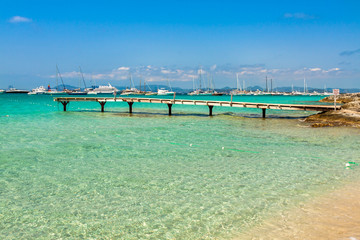 Formentera tropical Mediterranean sea wooden pier in Illetes bea