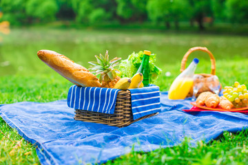 Basket with grapes and two glasses of the white wine