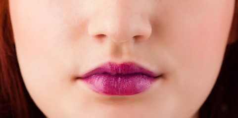 Fototapeta premium Beautiful woman red lips close up