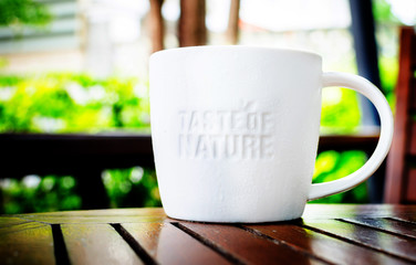 White ceramic mug with stamp word 