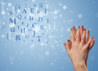 Happy smiley fingers looking at mixture of bokeh letters