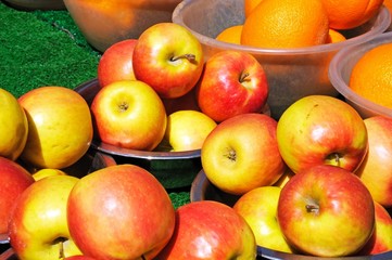 Apples in bowls on market stall © Arena Photo UK