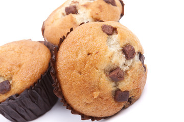 three chocolate chip muffin on a white background