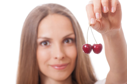 Hand Holding Two Fresh Cherries