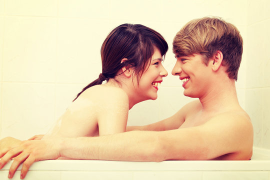 Young couple taking a bath.