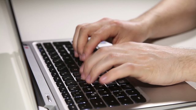 Typing on laptop
