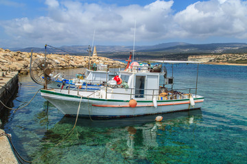 Fototapeta na wymiar Fishing boats in a port in Pafos, Cyprus