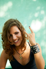 Portrait of young woman in heavy metal style