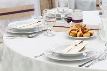 an image of tables setting at a luxury wedding hall
