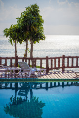 tropical resort swimming pool overlooking sea. Koh phangan