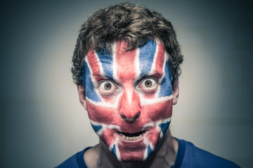 Scary man with British flag painted on face
