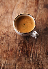 espresso coffee cup on rustic table with sun