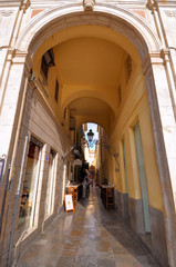 MALAGA - JUNE 12: City street view with cafeteria terraces and s