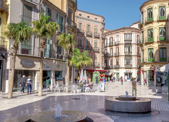 MALAGA - JUNE 12: City street view with cafeteria terraces and s