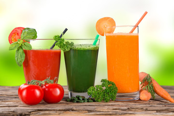 Fresh juice, healthy drinks on wooden table.