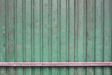 green rusted iron wall