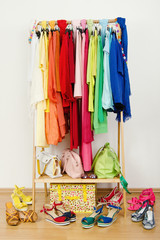 Wardrobe with summer clothes,sandals,purses nicely arranged. - 66590962