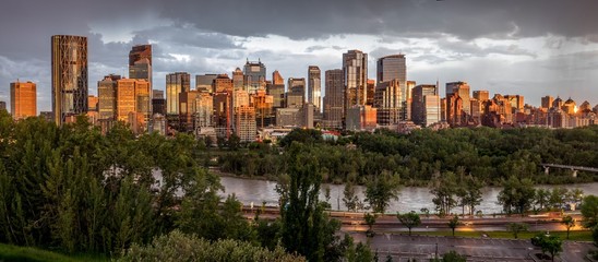 Calgary skyline at night with Bow River - obrazy, fototapety, plakaty