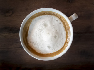 Cappuccino Coffee on wooden table background