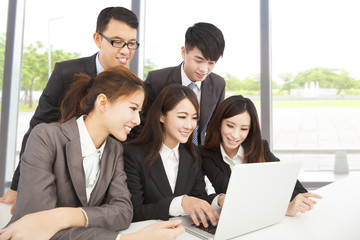 happy asian business team working in office