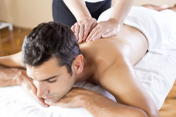 Obraz na płótnie Canvas Young man having a massage