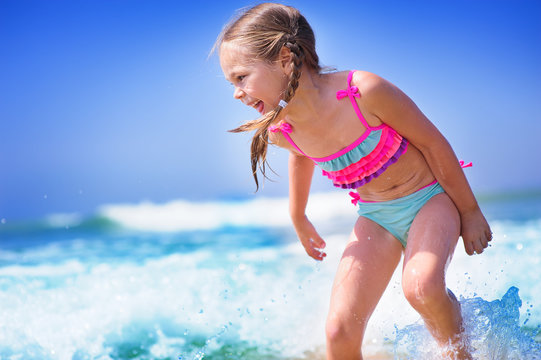 happyt child girl on a  tropical beach ocean