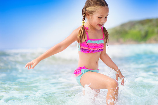 happyt child girl on a  tropical beach ocean